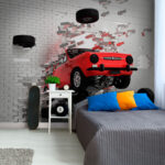 Wall murals Car crashes through brick wall