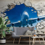Wall murals Jet bursts through cracked wall.