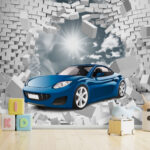Wall murals Blue car bursts through brick wall