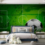 Wall murals Football ball on a green field