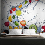 Wall murals Fruit splashing into water