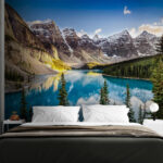Wall mural Body of water with trees and mountains in the background
