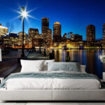 Wall murals City skyline at night with a body of water