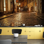 Wall murals Stone street with buildings and street lights