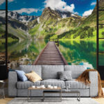 Wall murals Wooden dock over a lake with mountains in the background