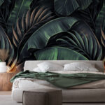 Wall murals Dark tropical leaves pattern design.