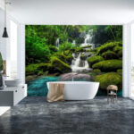 Wall murals Waterfall flowing through lush greenery.