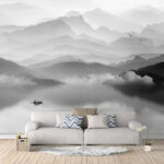 Wall murals Boat in a lake with mountains in the background