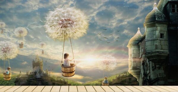 Girl in a basket on a swing with a dandelion in the sky Wall murals Girl in a basket on a swing with a dandelion in the sky