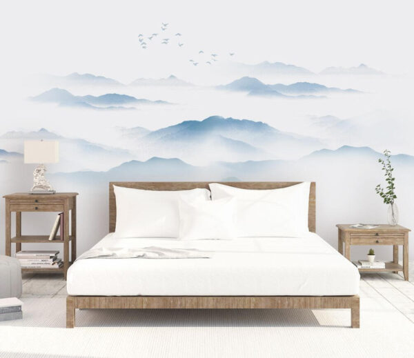 Birds flying over a foggy mountain range Wall murals Birds flying over a foggy mountain range