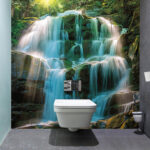 Wall murals Mystical waterfall in lush forest.