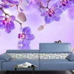Wall murals Two swans in a lake with purple flowers