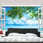 Wall murals Window with a view of the beach and birds