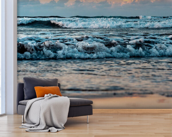 Waves dance under a sunrise sky Wall murals Waves dance under a sunrise sky