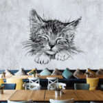 Wall murals Sleeping kitten drawing on paper.