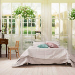 Wall murals Sunlit room with hanging plants.
