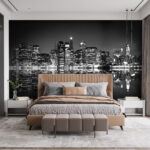 Wall murals City skyline at night with lights reflecting on water