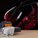 Wall murals Glass of red wine being poured