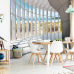 Wall murals Sunny beach view through geometric windows.