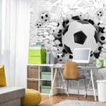 Wall murals Soccer balls burst through the wall.