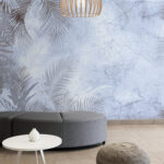 Wall mural Tropical leaves on textured background