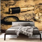 Wall murals Magnifying glass and a telescope on a map