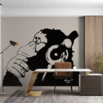 Wall murals Monkey wearing headphones