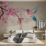 Wall murals Hummingbird hovers near vibrant blossoms