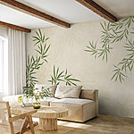 Wall mural Green leaves on a white surface