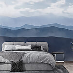 Wall murals Mountain range with clouds