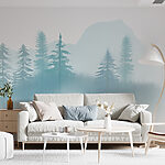 Wall murals Foggy landscape with trees and mountains