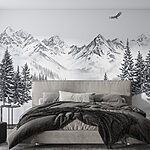 Wall murals Snowy mountain landscape with trees and a bird flying over it