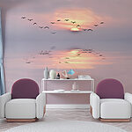 Wall mural Birds flying in the sky with the sun behind them