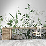 Wall mural Green leaves on white background